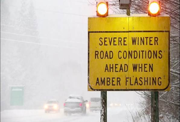 Winter road sign reading "severe winter road conditions when amber flashing" Top 10 Truck Driving Tips for Winter